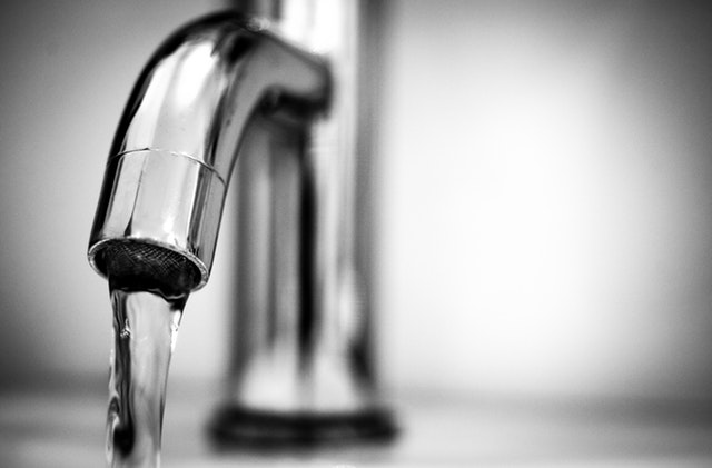 water-tap-black-and-white-macro